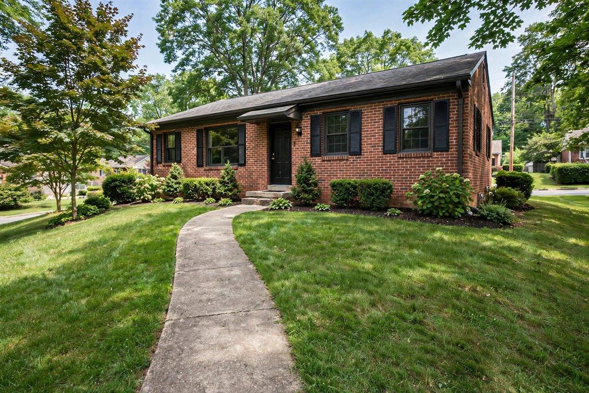 Brick ranch home with a broad front lawn in Palmdale, Hershey, crossed by the water service line route